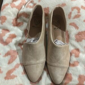 Cream colored faux leather flat